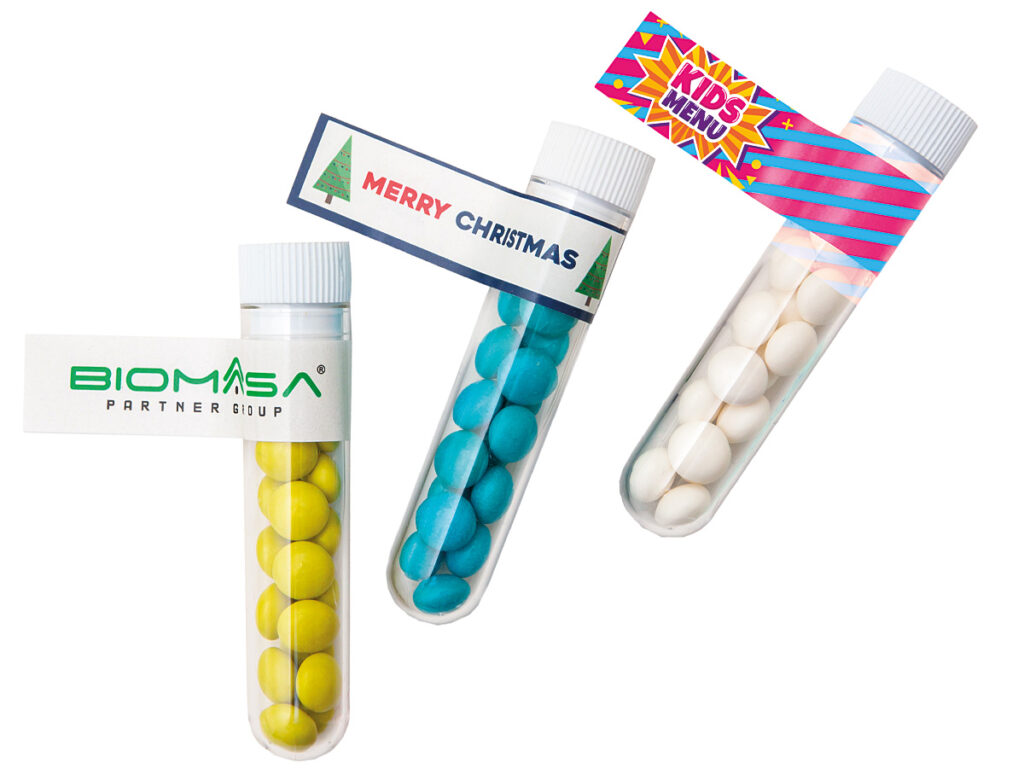 Owocowe drażetki w przezroczystej fiolce z logo klienta na dwustronnej chorągiewce